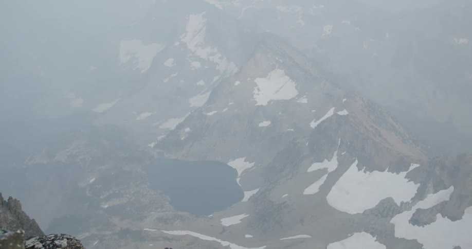 Aerial view of snow covered mountains are displayed