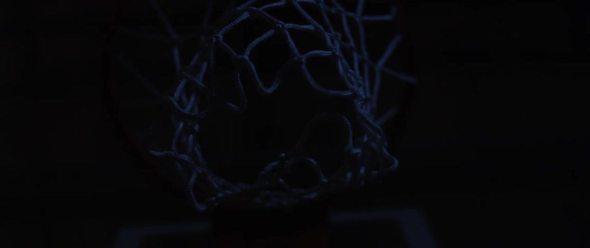 A basketball net waves after the ball makes point