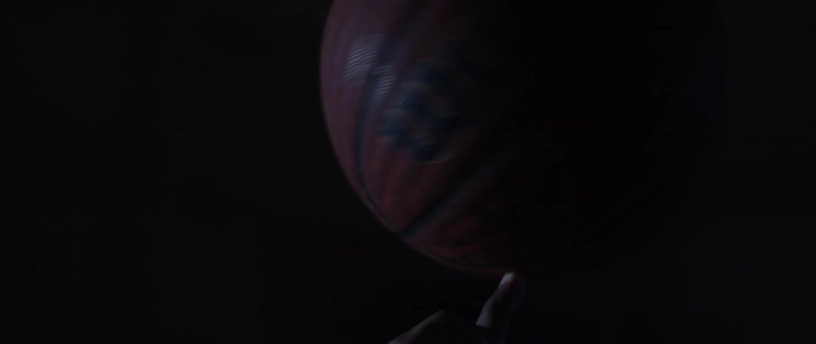 Basketball spinning on the tip of a finger