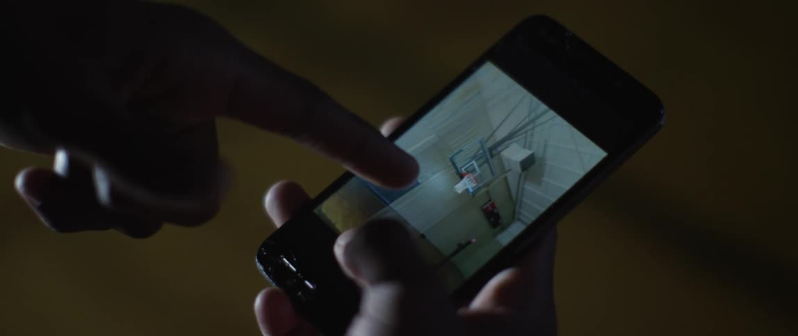 A persons finger swiping on a cell phone screen