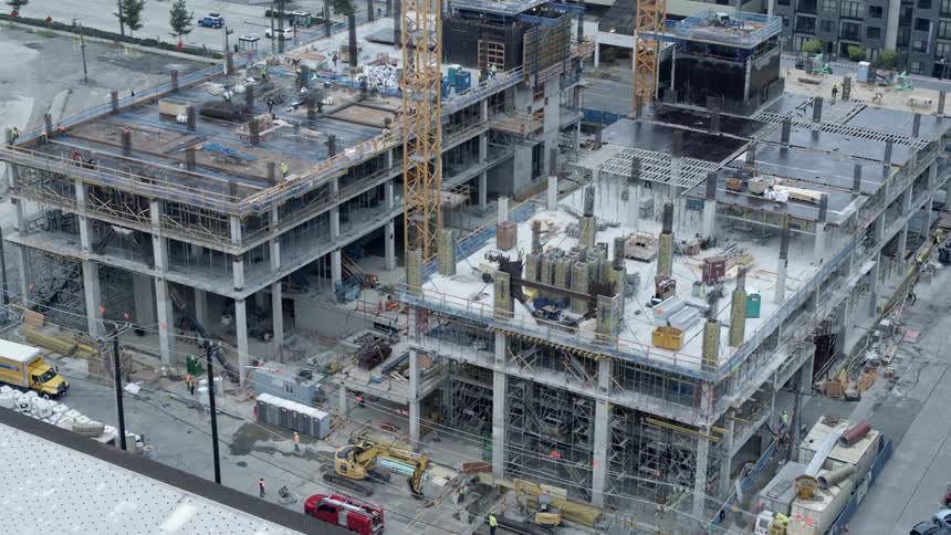 Low orbit around a downtown construction site as contractors are busy working