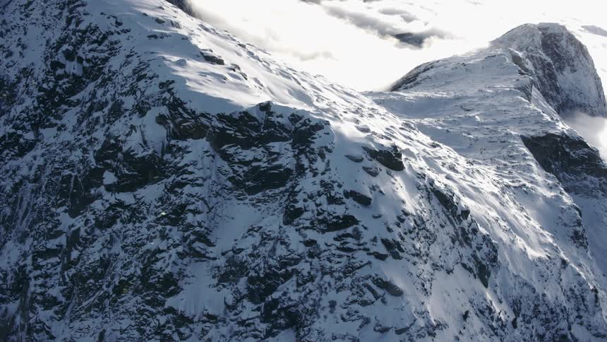 Aerial view of a snow capped mountain ridge