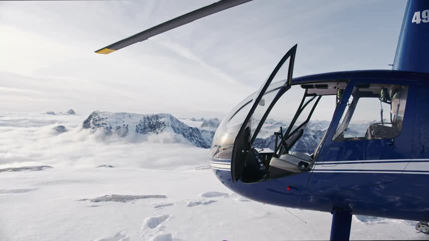 A helicopter is parked in an arctic area