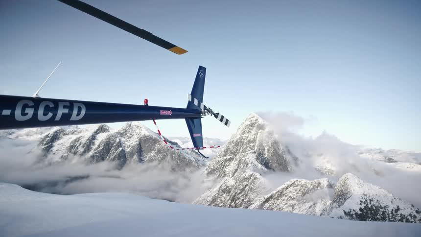 A helicopter is parked in an arctic area