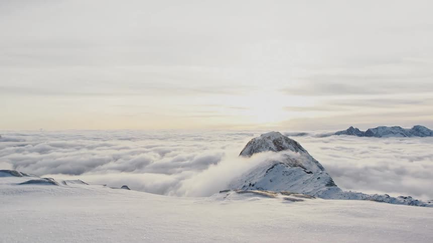 Clouds are covering the mountains at dusk