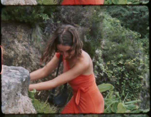 A film strip of a young woman climbing down a ladder on a hill