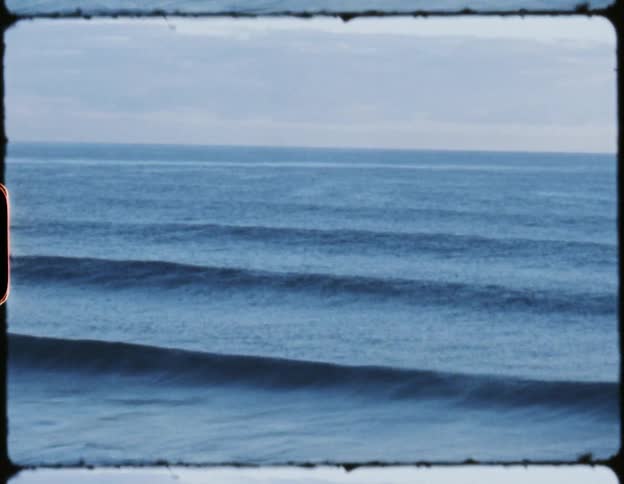 A film strip of waves rolling in on the ocean