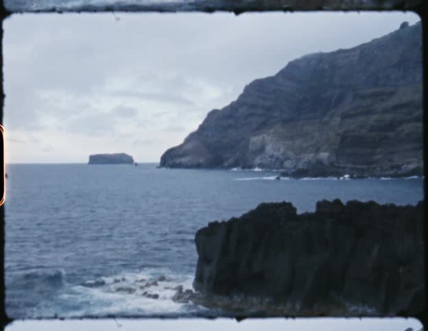 A film strip of a cliff on the coast
