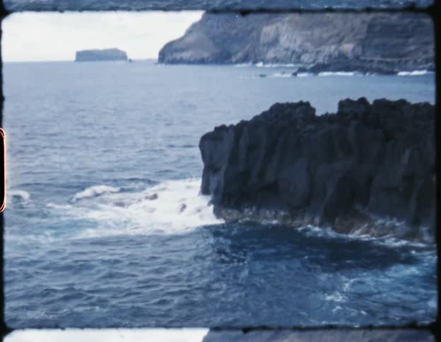 Ocean waves crashing against the cliffs on the coast
