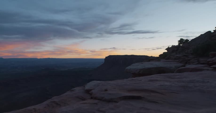 The sun is below the horizon of a beautiful canyon landscape