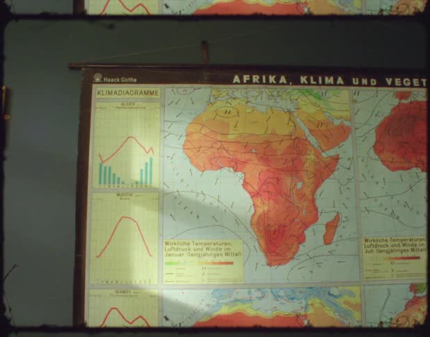 A map hangs on a wall in a room