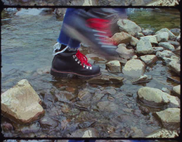 A film of a person walking through a river