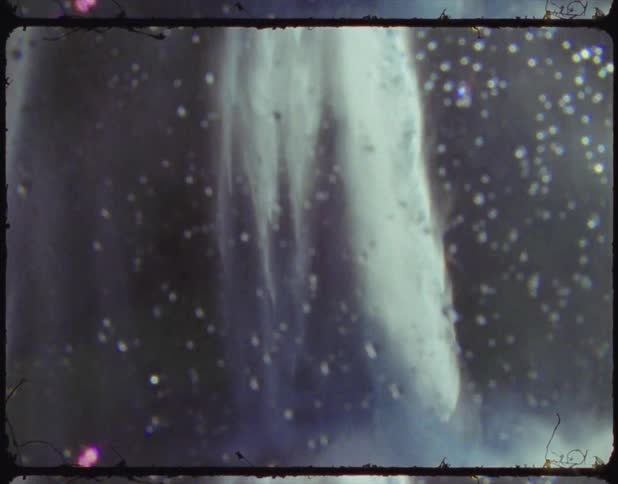 A film of a waterfall crashing in to a river below