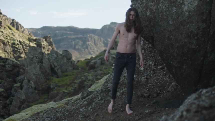 A man is hiking outdoors in spring