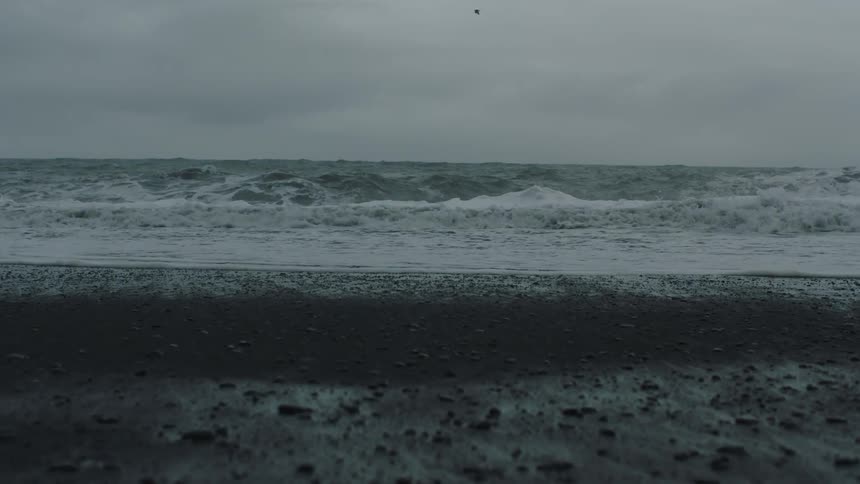 Water is moving towards the coast of the beach