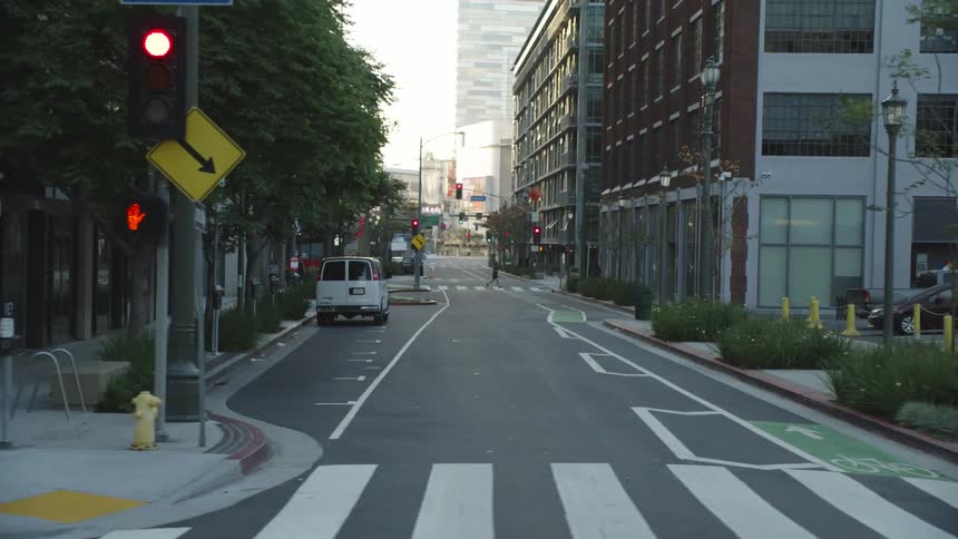 Panning shot of a city street at an intersection