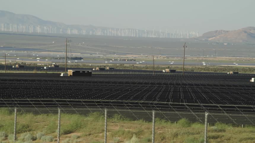 A storage area on the fields near the wind turbines on the hills