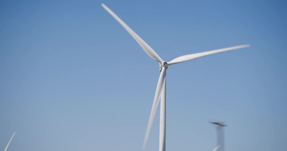 A wide shot of a spinning windmill