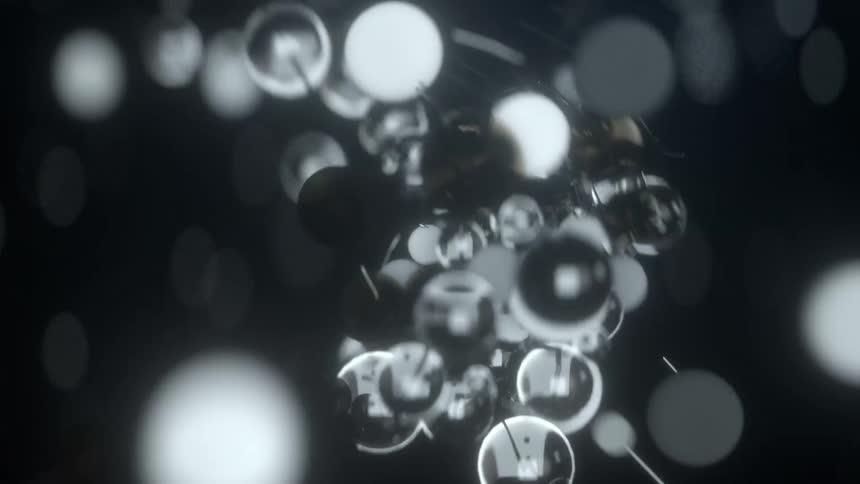 Atoms swarm together to create a vibrating molecule underwater