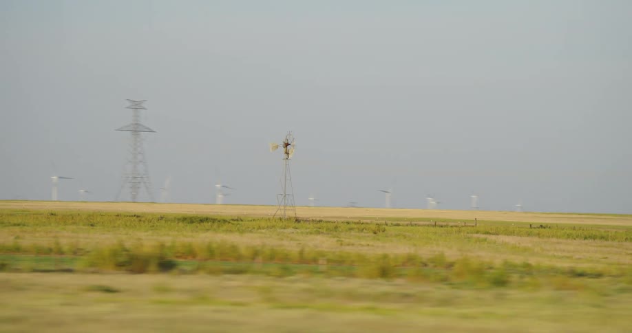 A close up of a small wind device in a field