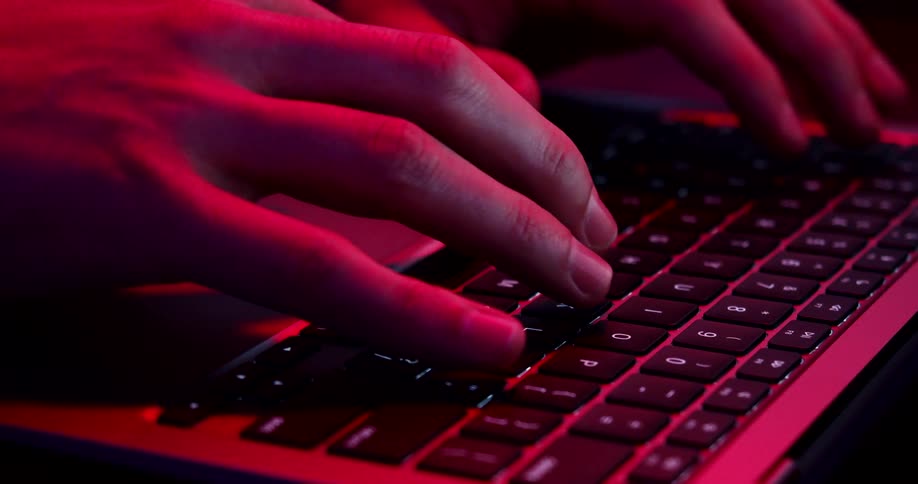 A person typing on a keyboard
