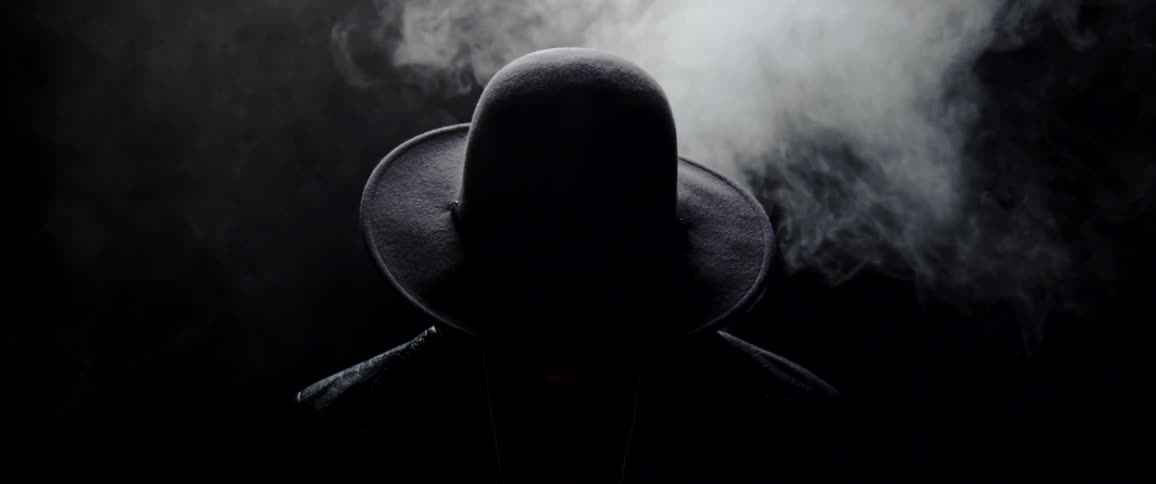 A person behind a cloud of smoke