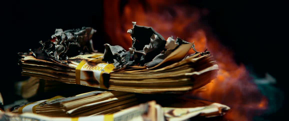 Stacks of bills going up in flames