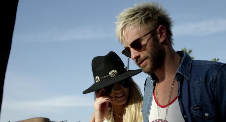 Young couple walking on the streets of a tropical city