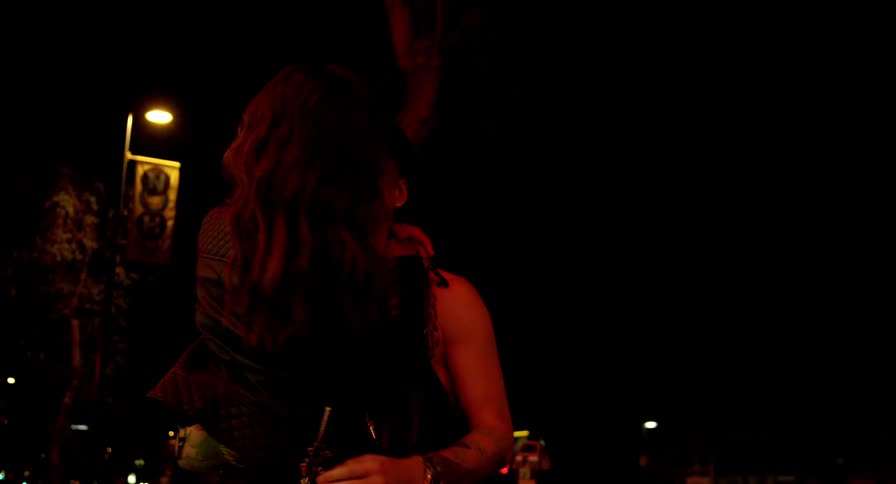 A couple hugs and kisses while standing inside