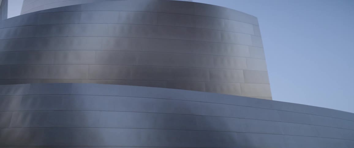 A panning shot of a convention center at dusk