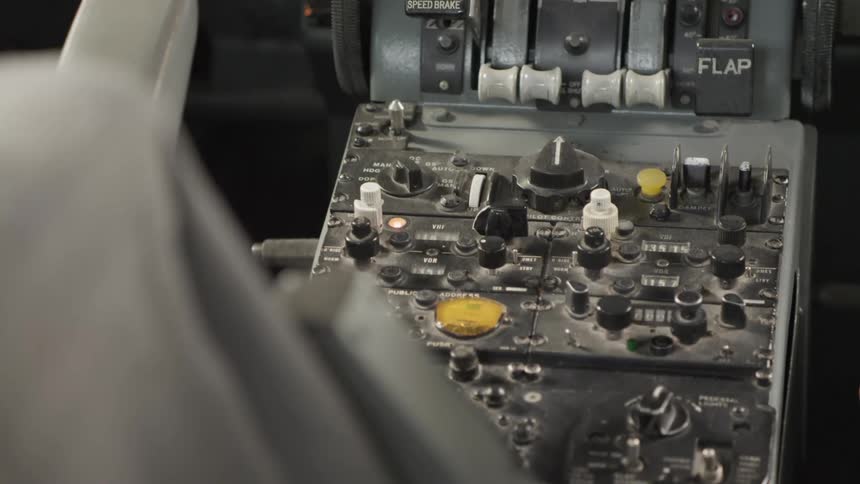 A close up of a aircraft control panel