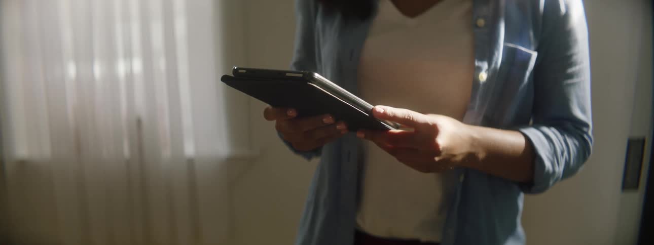 A woman looking at a tablet