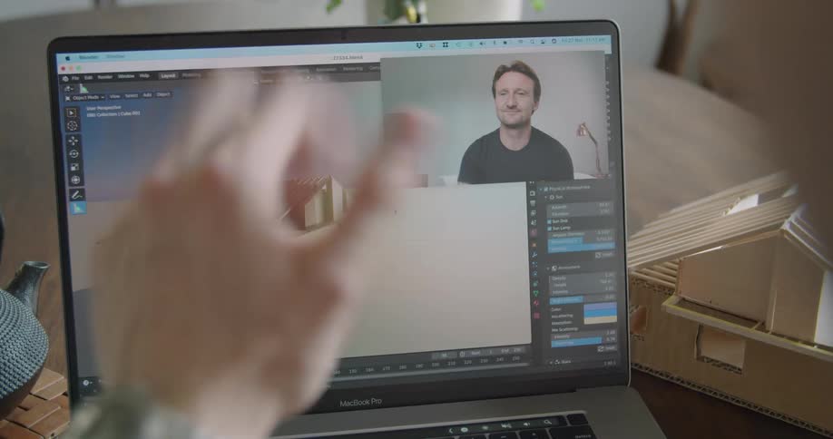 Two men working on a building project say goodbye after a video chat on a laptop