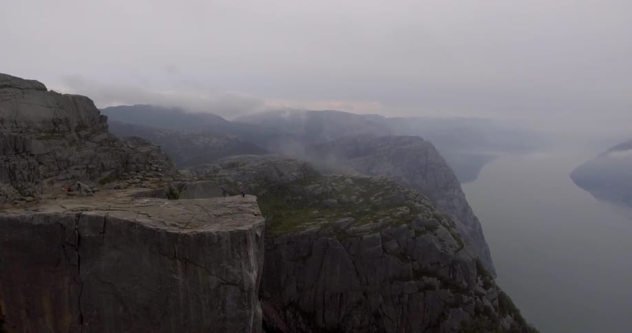 A mossy cliff on a foggy day