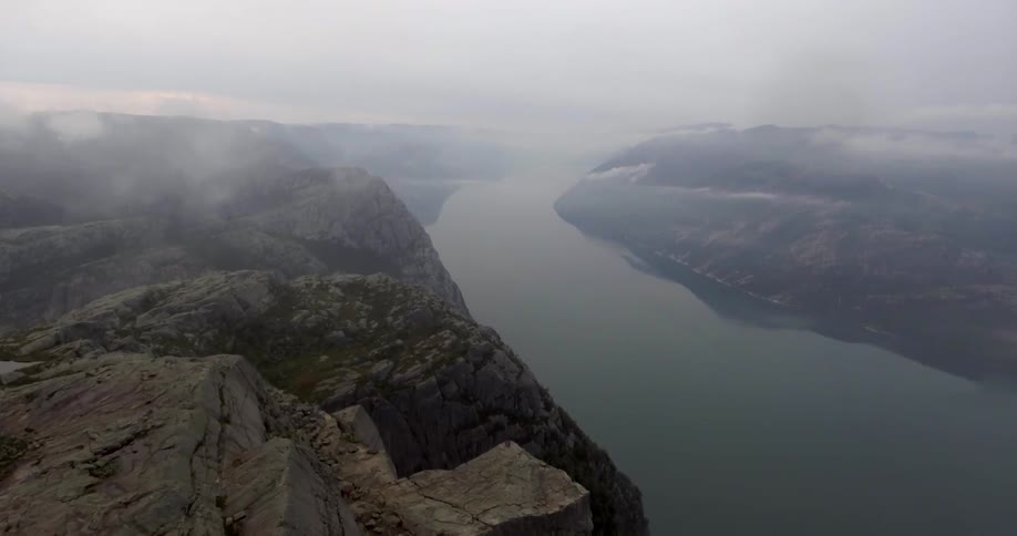 Aerial view of a body of water between a mountain range