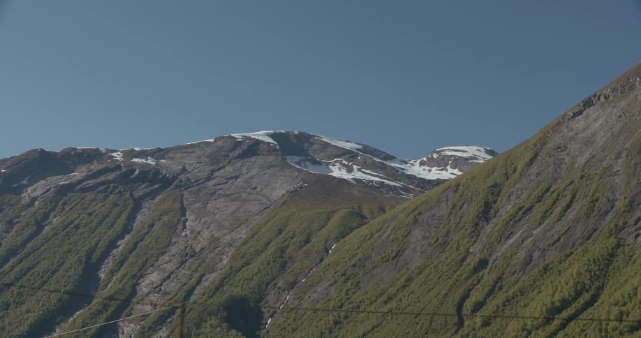Snow-capped mountains loom in the distance