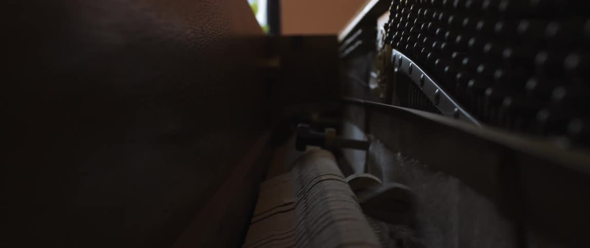 A close up of the inner workings of a piano