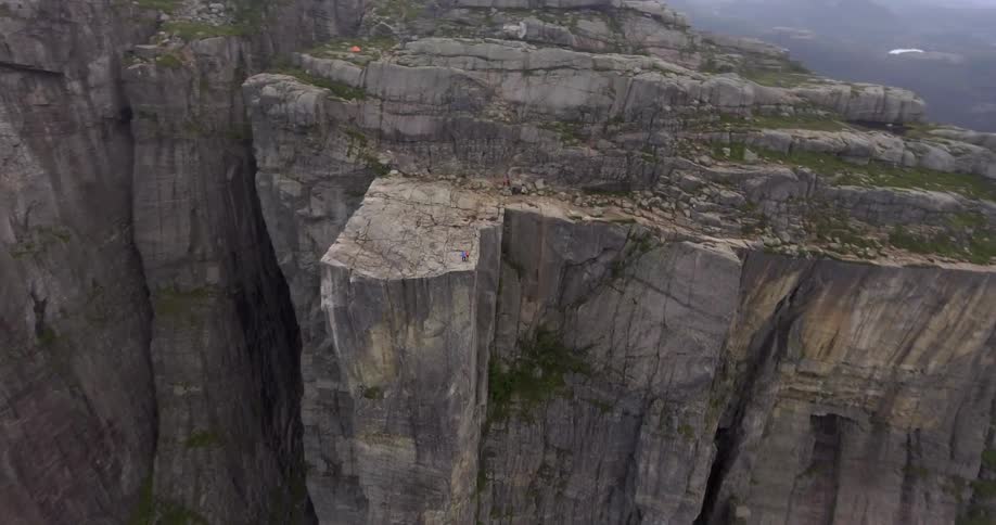 A rocky cliff during the day