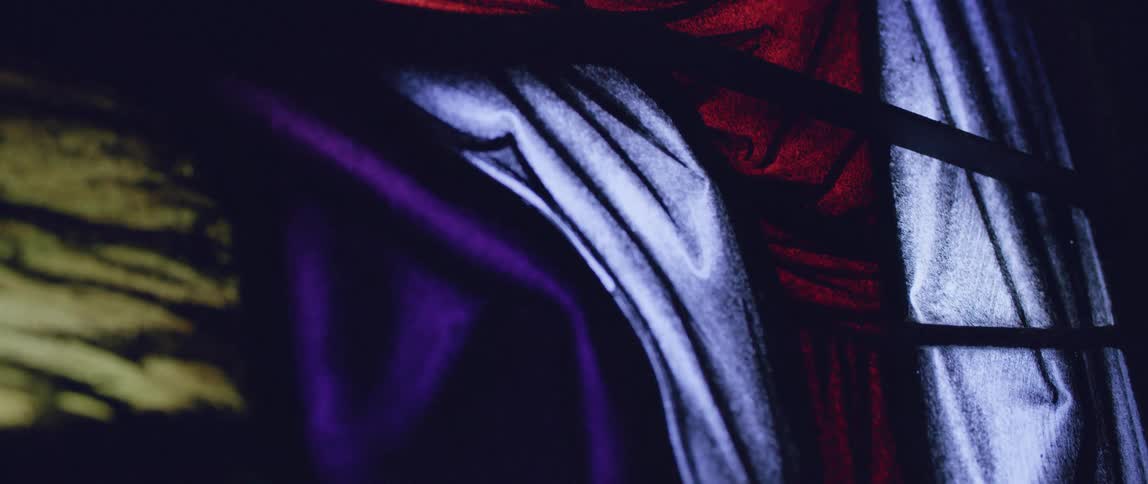 Purple white red and yellow colors that look like a stained glass window