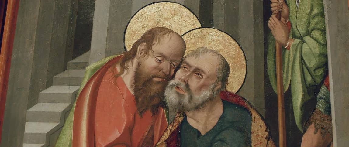 A close up of a painting with two bearded men with robes and halos