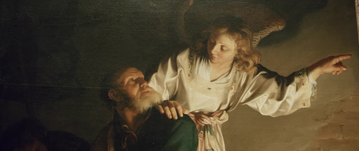 Close up of a classical painting depicting an angel talking to an old man