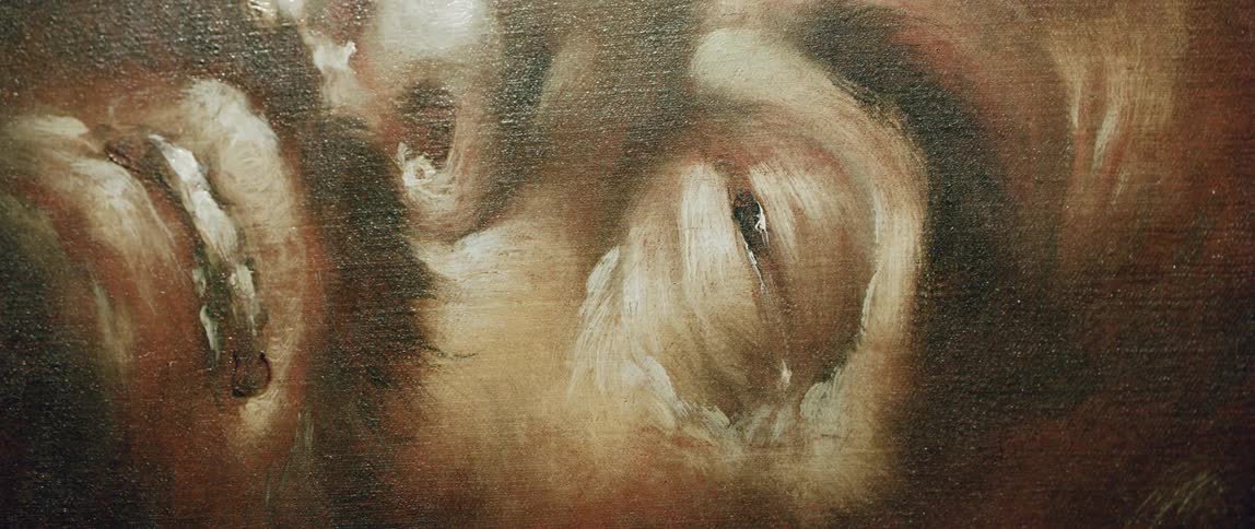 Close up of a portrait of a man in oil over canvas