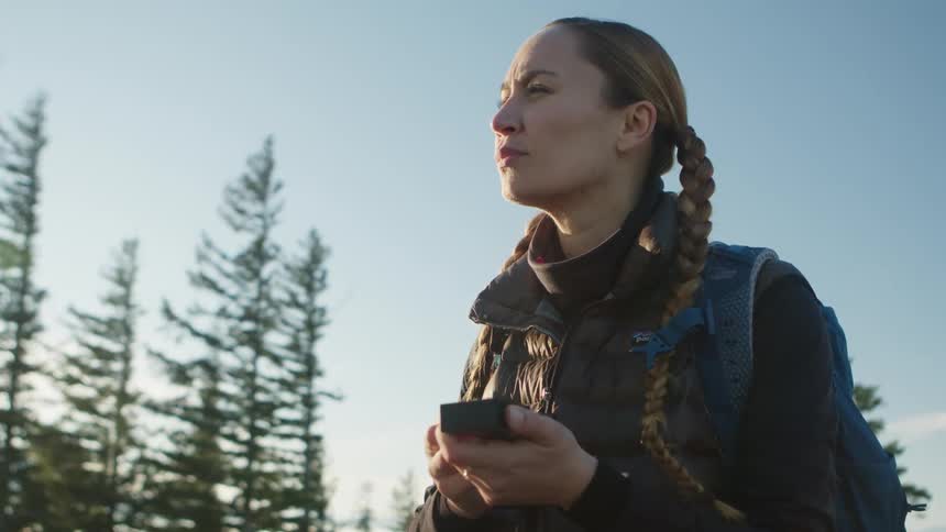 A woman making a stop by the forest