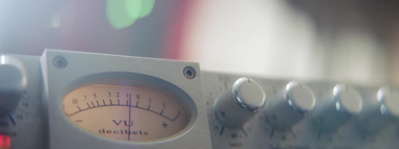 An electronic mixer with dials lights and a needle