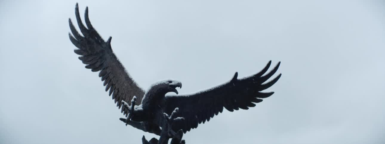 Eagle statue during snowfall