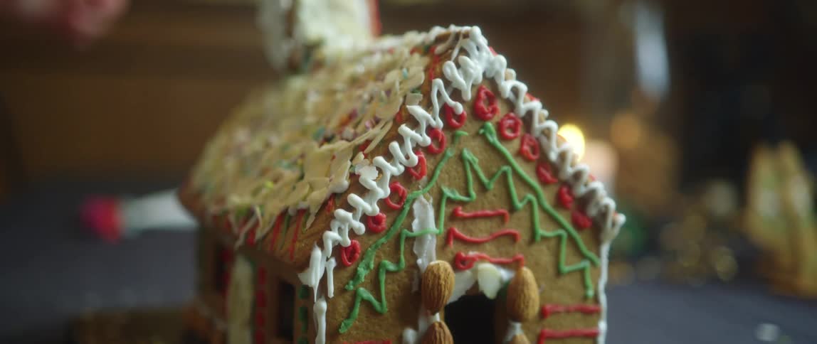 A close up of a decorated gingerbread house