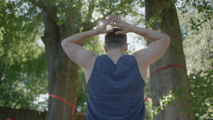 A man stretching and walking away
