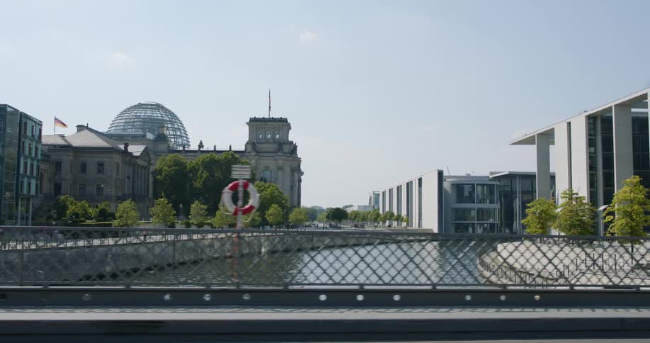 Crossing the bridge over a river near the bundestag the german federal parliament
