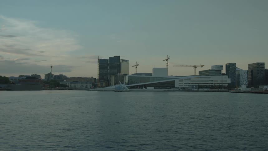 A waterside city near sunset