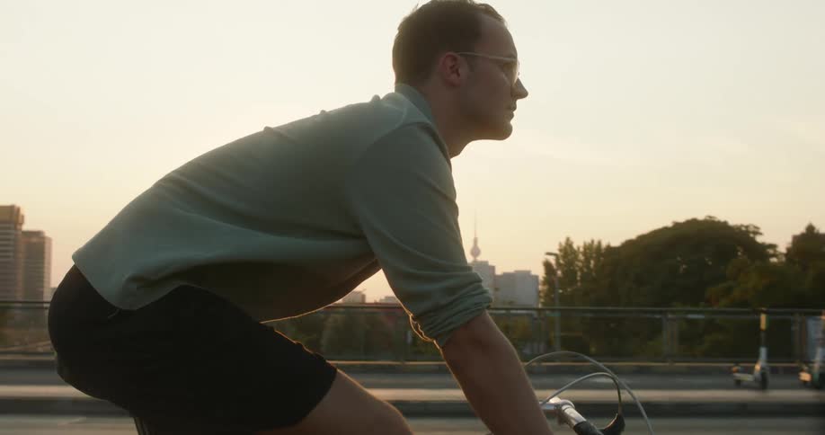 A man riding a bike in a city